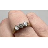 An 18ct gold diamond trilogy ring. Size M. Gross weight approximately 3.1 grams. Estimated total