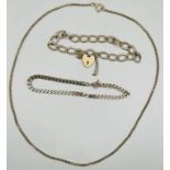 A selection of 9ct gold jewellery comprising a heart padlock clasoed charm bracelet; a curb chain