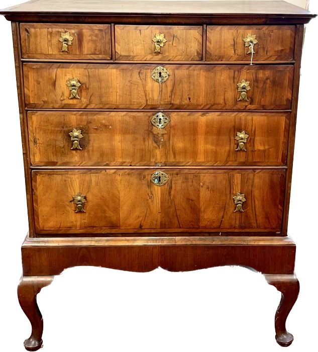 A Queen Anne figured walnut cross-banded chest on stand, rectangular shape, moulded cornice above