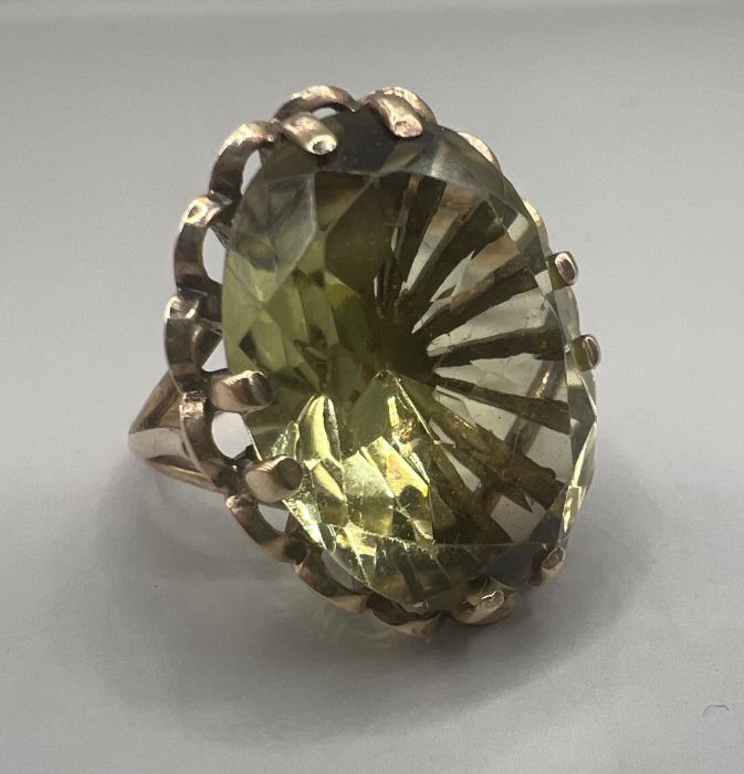 A 9ct gold green quartz set cocktail ring. Gross weight approximately 7 grams.