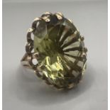 A 9ct gold green quartz set cocktail ring. Gross weight approximately 7 grams.