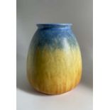 A Ruskin Pottery orange and blue crystalline glaze vase Height 21cm Marked Ruskin England 1931