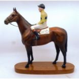 A large Beswick Horse and Jokey mounted on the Grand National winner Arkle, wearing No 6 , in good