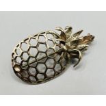 A pineapple pendant and brooch in 9ct - won in 1974 as a prize in the Del Monte Diamond Time