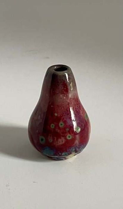A Ruskin Pottery miniature high fired flambé glaze vase Height 4cm Marked Ruskin England Condition