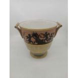 A 19th century French porcelain two handled ice pale, with gilt decoration and depicting a Greek