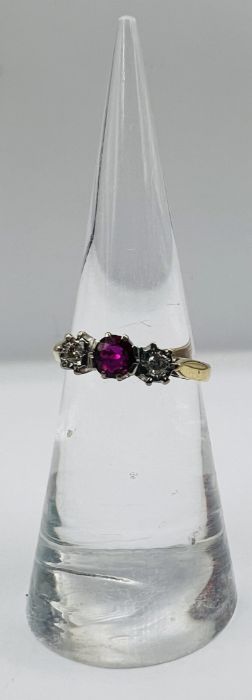 An 18ct gold ruby and diamond trilogy ring, along with a pair of ruby ear studs, stamped 375. The - Image 3 of 7