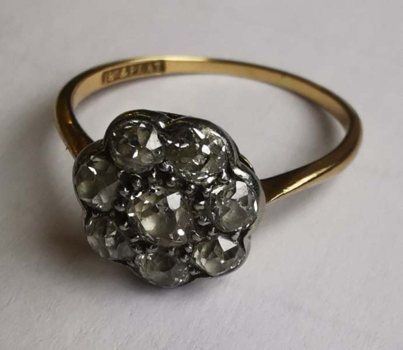 A diamond and 18ct gold and platinum flower cluster ring, set with old cut diamonds, head approx.