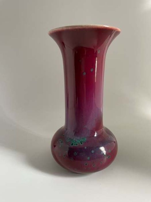 A Ruskin Pottery high fired globe and shaft flambé glazed vase Height 21.5cm Marked Ruskin,