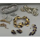 A selection of quality costume jewellery comprising a purple cabochon stone set Trifari goldtone