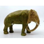 A Royal Dux elephant painted in typical palette, unmarked, 12cm high