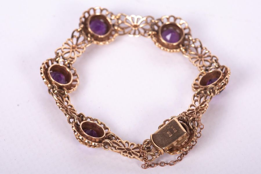 An Amethyst bracelet set with six very fine deep coloured Amethysts in yellow metal in a floral - Image 2 of 3