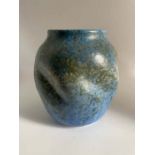 A Ruskin Pottery green crystalline glaze vase of gourd form with shallow spiral indents Height