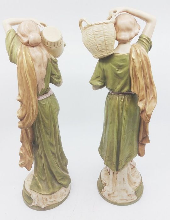 A pair of Royal Dux figures of a male fruit collector and a female water carrier, painted in typical - Image 12 of 12