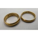 A pair of 22ct gold band rings. Total weight approximately 8.7 grams.