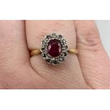 A 1920s-1930s ruby and diamond cluster ring. In yellow metal. Gross weight approximately 2.2