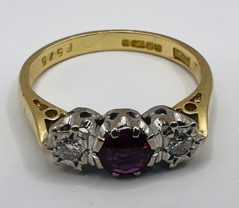 An 18ct gold ruby and diamond trilogy ring, along with a pair of ruby ear studs, stamped 375. The - Image 5 of 7