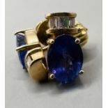 A pair of Tanzanite and diamond ear studs. In yellow metal, stamped 14k to the posts.