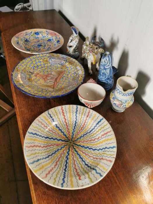 Three polychrome tin glazed chargers, a jug, bowl, a faience vase modelled as a cow, a faience - Image 2 of 4