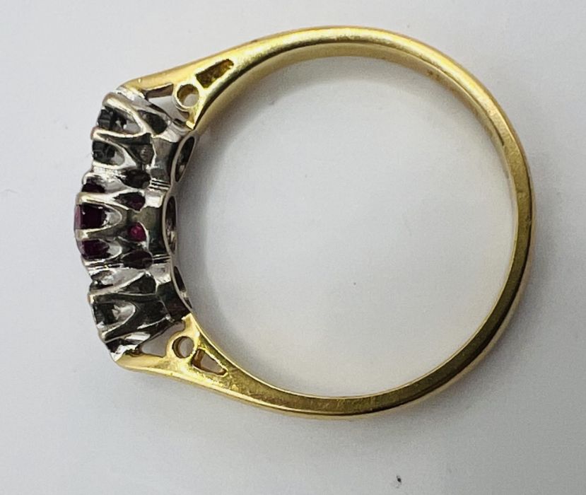 An 18ct gold ruby and diamond trilogy ring, along with a pair of ruby ear studs, stamped 375. The - Image 7 of 7