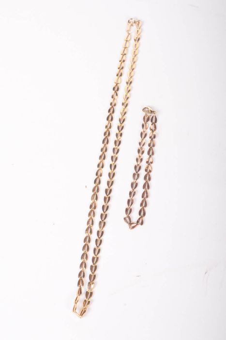 A fancy link 9ct yellow gold chain necklace with matching yellow metal bracelet stamped 9ct. Total