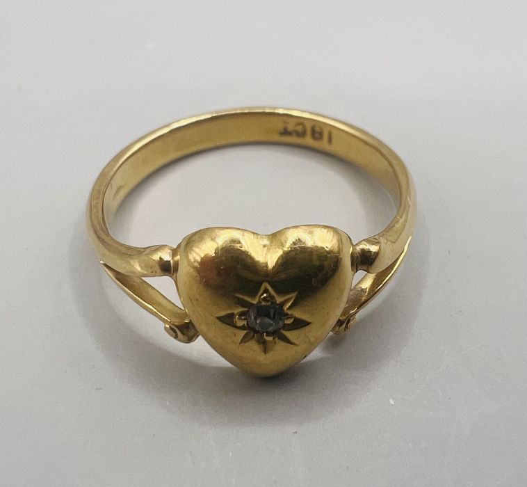 A diamond chip set heart-shaped ring. Pleas note issue with split shank connection - refer to