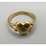 A diamond chip set heart-shaped ring. Pleas note issue with split shank connection - refer to