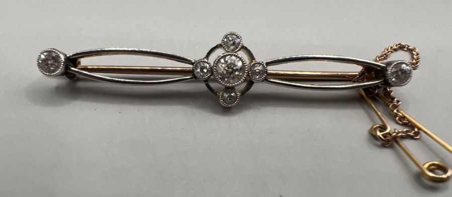 An Edwardian yellow and white metal diamond set brooch, central diamond old European cut, - Image 3 of 6