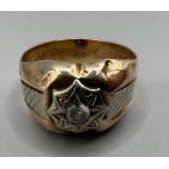 A yellow metal white stone set ring, stamped "750" and "18ct". Gross weight approximately 6.9 grams.