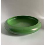 A large Ruskin Pottery shallow bowl in apple green lustre glaze Diameter 31cm Marked Ruskin