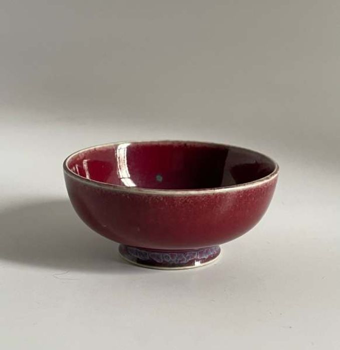 A Ruskin Pottery miniature high fired flambé footed bowl Diameter 6cm height 2.5cm Marked Ruskin