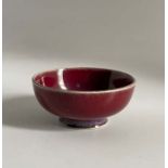 A Ruskin Pottery miniature high fired flambé footed bowl Diameter 6cm height 2.5cm Marked Ruskin