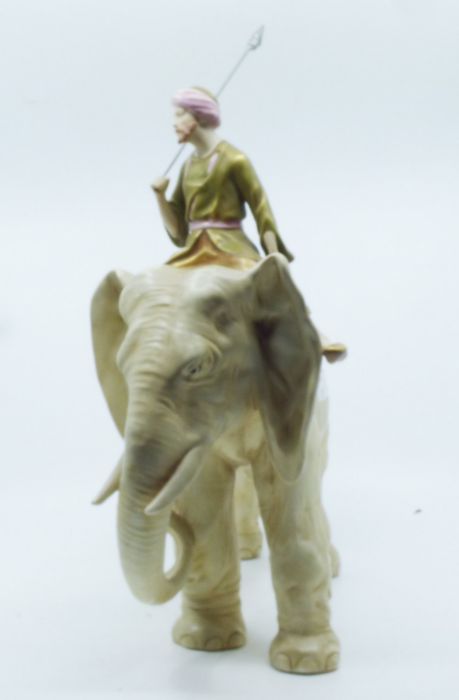 A Royal Dux model of an elephant and Mahout, the Mahout dressed in robes and carrying a lance, - Image 2 of 3