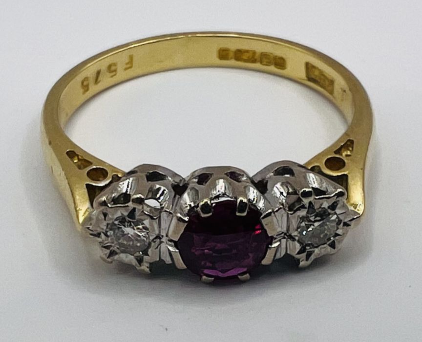 An 18ct gold ruby and diamond trilogy ring, along with a pair of ruby ear studs, stamped 375. The - Image 6 of 7