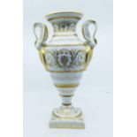 A French Empire style porcelain twin handled vase, 20th century, overall tooled gilt foliate
