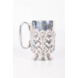 A sterling silver Christening mug, hallmarked Birmingham 1903, with an embossed leaf and flower