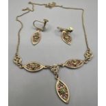 A vintage Clogau gold suite of 9ct gold Celtic design jewellery, set with green stones, comprising a