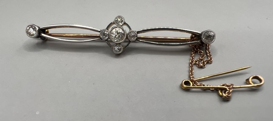 An Edwardian yellow and white metal diamond set brooch, central diamond old European cut, - Image 2 of 6