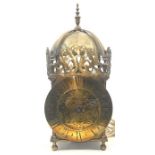A 17th century revival brass lantern clock, mounted with vase finials, beneath domed bell bearer