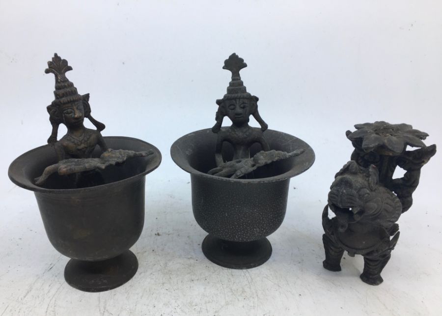 A pair of 20th century Indian bronze pedestal bowls with figural centres, height 12.5cm together