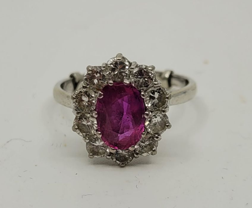 An 18ct. white gold, pink sapphire and diamond cluster ring, set mixed oval cut sapphire bordered by - Image 2 of 3