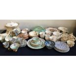 A large collection of porcelain items to include part tea sets and part dinner service, various