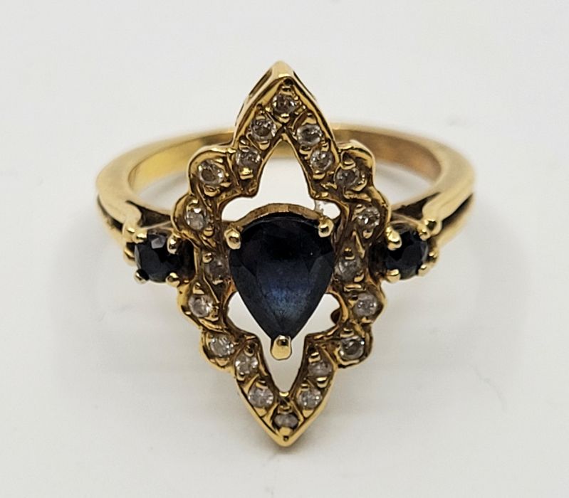 A precious yellow metal, diamond and sapphire set dress ring, having pierced navette form mount - Image 4 of 4