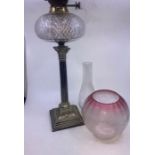 A 19th cent oil lamp with original shade