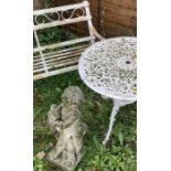 A collection of vintage garden items including a wrought iron bench