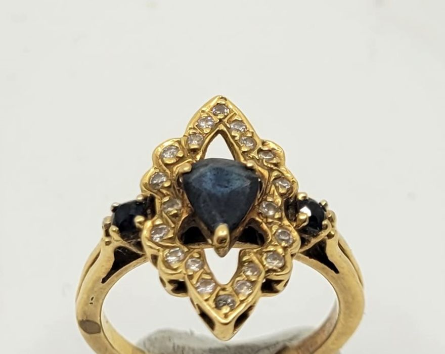 A precious yellow metal, diamond and sapphire set dress ring, having pierced navette form mount - Image 2 of 4