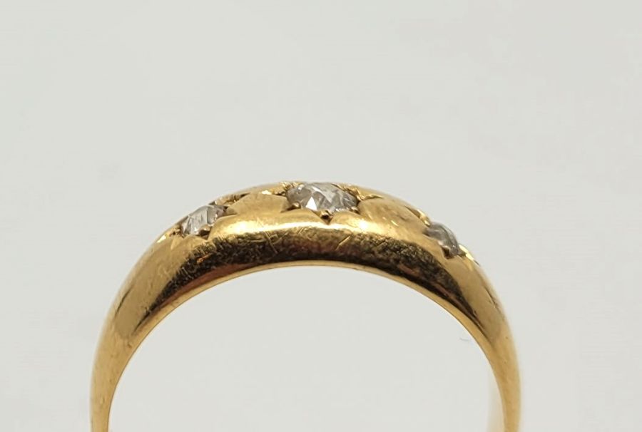 An 18ct. gold three stone diamond ring, Birmingham 1924, gypsy set three graduated old-cut diamonds, - Image 2 of 2