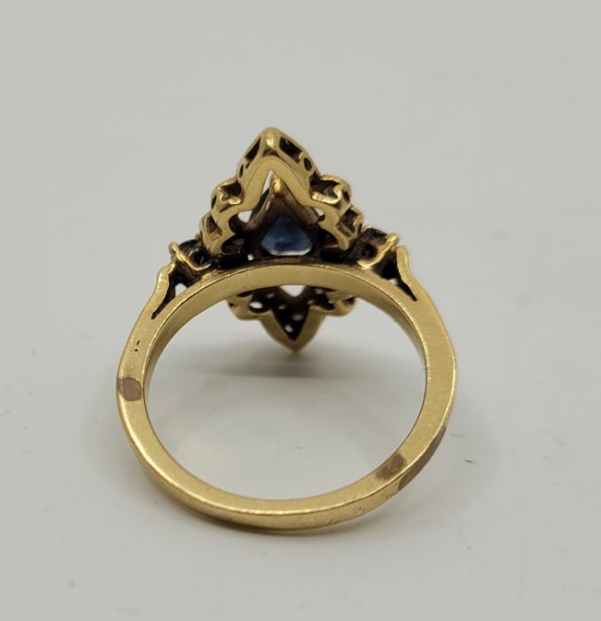 A precious yellow metal, diamond and sapphire set dress ring, having pierced navette form mount - Image 3 of 4