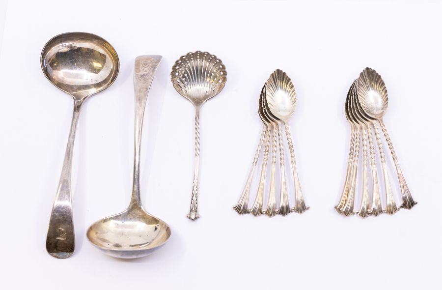 A set of eleven late Victorian silver Onslow style teaspoons, with shell bowls, hallmarked by Josiah