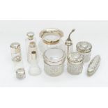 A small collection of silver rimmed or topped cut glass items to include; a fluted Birmingham silver
